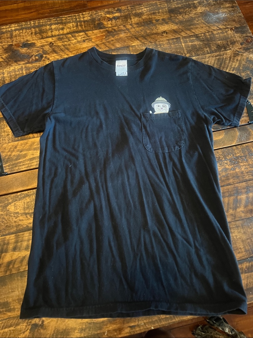 Rip and dip T-shirt with pocket graphic.